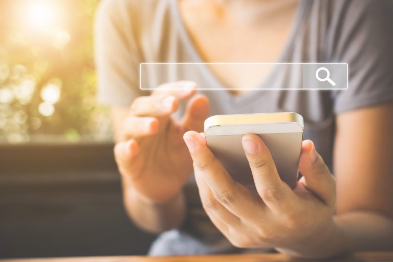Woman Using Smartphones to Google