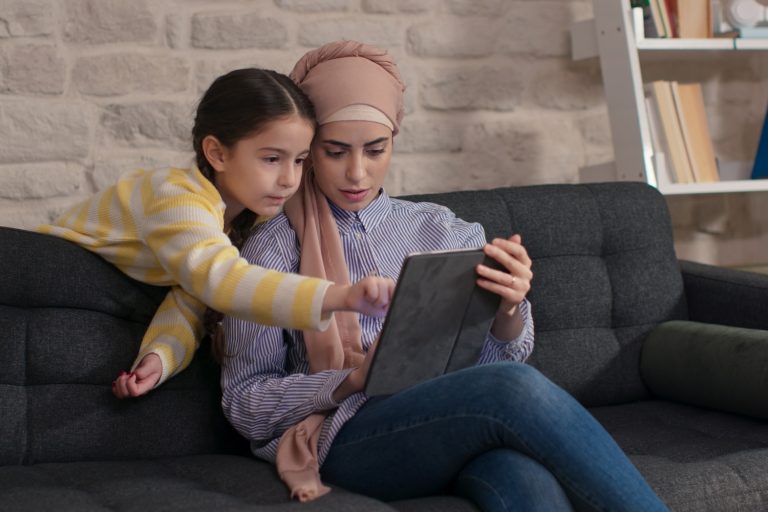 Family Using Tablet to Browse Websites