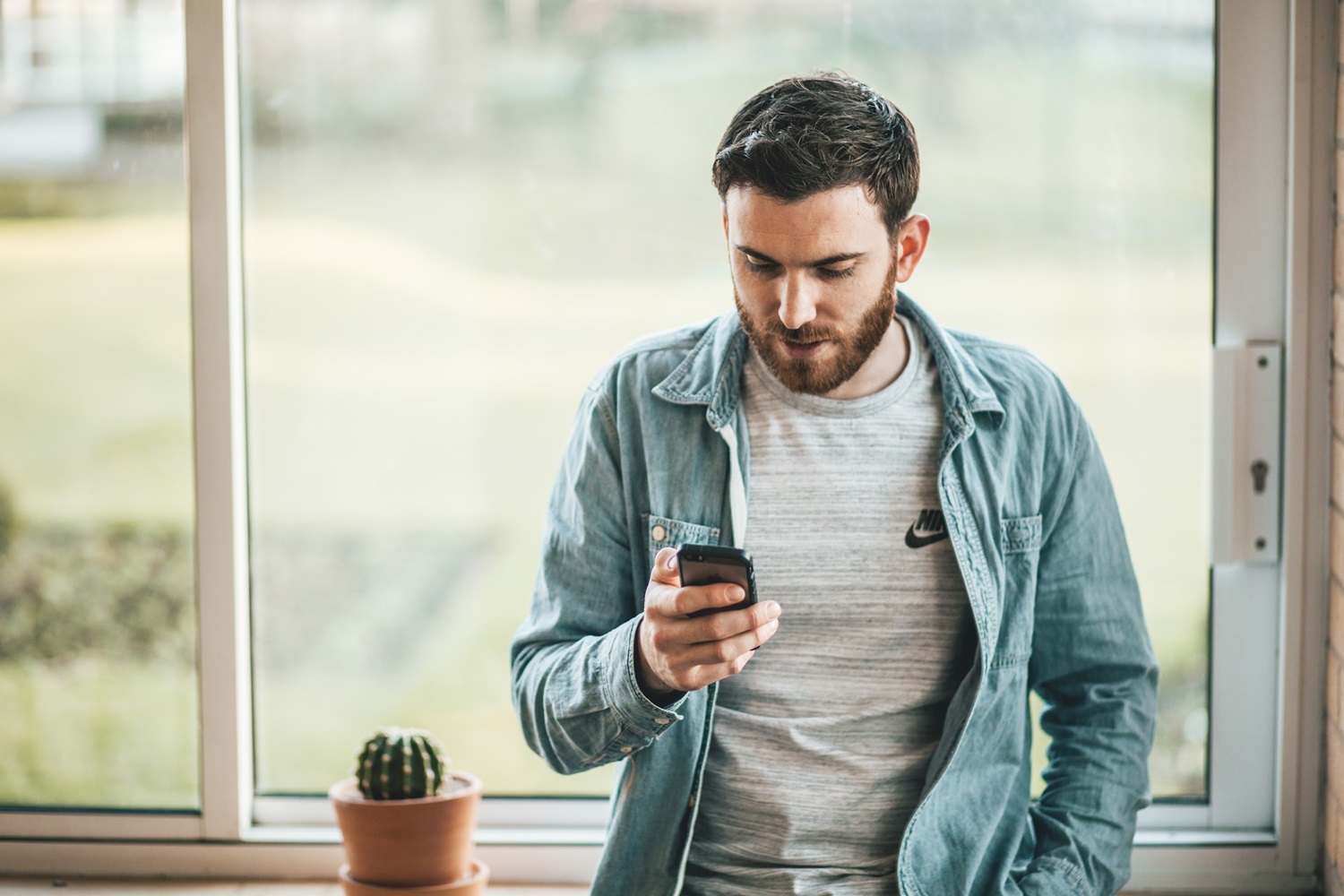 Man Checking Accounting Website on Mobile Phone