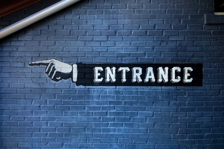 This Way Sign for Entrance