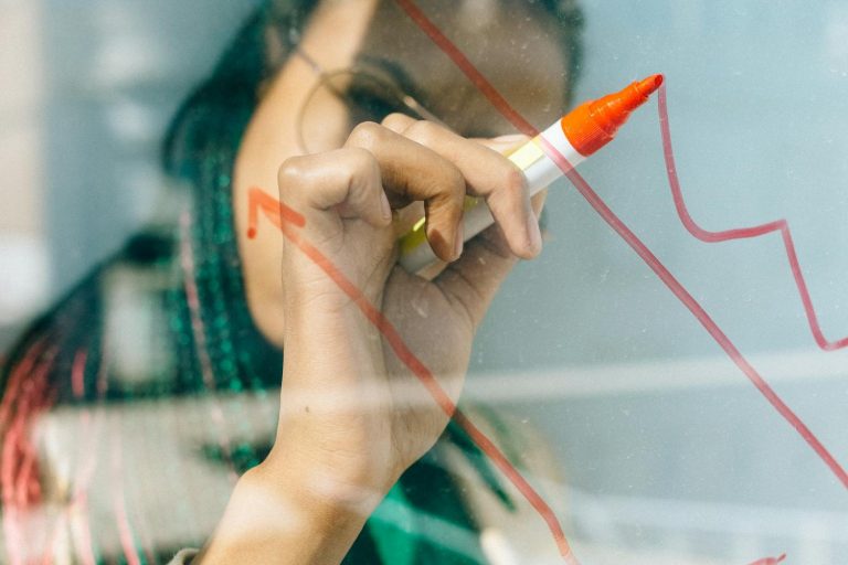 Woman Writing On Whiteboard