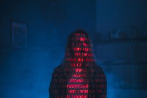 mysterious silhouette with red binary code